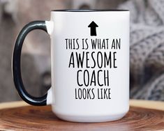 this is what an awesome coach looks like black and white coffee mug on a wooden table