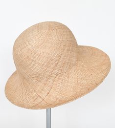 "\"Pina\" is a light summer sun hat with a wide flared brim. The shapely curve of the brim ensures a perfect fit and underlines a clear, feminine look. The material \"Bao\" made of the undyed fibres of the baobab tree is pleasantly permeable to air and ensures maximum wearing comfort. Available in sizes 55 cm - 60 cm. Colour \"nature\" Hat of \"Bao\" - Monkey bread tree Grosgrain ribbon (inside) made of 66% cotton and 34% polyamide Handmade Individualization options Other colours or sizes on req Chic Cloche Hat With Short Brim For Vacation, Lightweight Short Brim Sun Hat For Kentucky Derby, Chic Cloche Sun Hat For Vacation, Kentucky Derby Lightweight Short Brim Sun Hat, Chic Straw Cloche Hat With Short Brim, Elegant Lightweight Brimmed Straw Hat, Elegant Lightweight Sun Hat For Spring, Lightweight Wide Brim Cloche Hat, Woven Hat For Spring Garden Party