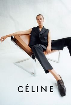 a man sitting on top of a wooden chair in front of a white background with the words celine written below him