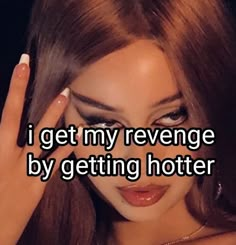 a woman holding her hand up to her face with the words i get my revegee by getting hotter