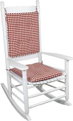 a white rocking chair with a red and white checkered cushion