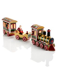 a toy train with santa riding on it