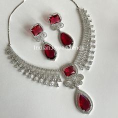 Ruby CZ diamond Bridal Necklace Jewelry,Indian Pakistani wedding Jewelry,Mother of the Bride,Teardrop Crystal Necklace, Bridesmaid, Gift Regular size and adjustable Earrings Length 2.5 inches Arrives in a gift box. Please let me know if you have any questions. Thank you so much for visiting my shop. Color, shades, and texture displayed may slightly vary from the actual product due to digital image limitations. We request you to consider these minor variations. Please expect the possibility of so Elegant Teardrop Bridal Necklace For Anniversary, Teardrop Diamond Jewelry Sets For Wedding, Hand Set Diamond Teardrop Bridal Necklace, Bridal Teardrop Diamond Necklace Hand Set, Wedding Jewelry Sets With Cubic Zirconia In Drop Shape, Elegant Teardrop Diamond Bridal Necklace, Red Cubic Zirconia Bridal Necklace For Wedding, Traditional Teardrop Bridal Necklace, Diamond White Diamond Drop Necklace For Wedding