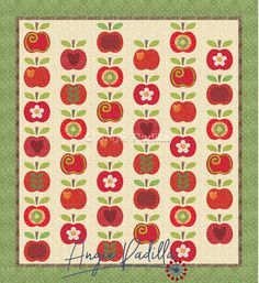 an apple quilt is shown with the words happy fall written in red, green and white