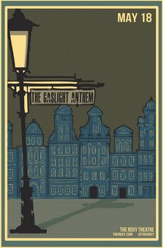 an old fashioned street light in front of a building with a sign that says the gaslight