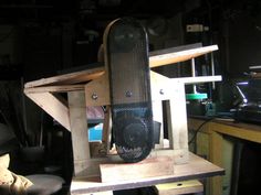 a skateboard sitting on top of a wooden table