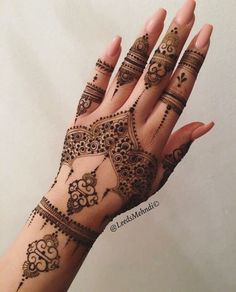 henna tattoo on the palm of someone's hand is shown in this screenshot