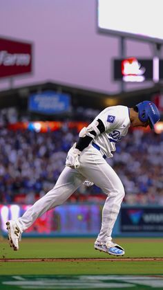 a baseball player is running on the field