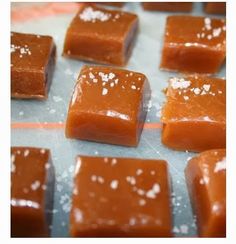 several pieces of caramel sitting on top of a baking sheet