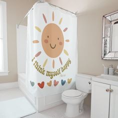 a white bathroom with a shower curtain that says thank mysel happy on the front