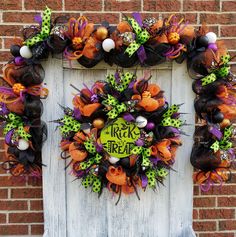 a halloween wreath on the side of a door