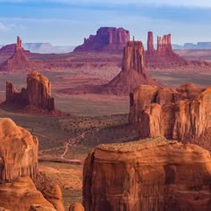 the desert is full of rock formations and mountains