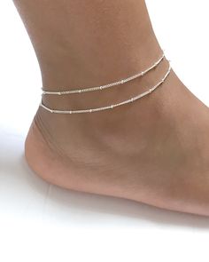 "Sterling Silver Adjustable Satellite Chain Anklet Double Layered Ankle Bracelet Minimalist and Dainty Ankle Bracelet Metal: All Components Are Made From Solid .925 Sterling Silver **Choose Size At Checkout** *Adjustable from 8\" to 9\" *Adjustable from 9\" to 10\" *Adjustable from 10\" to 11\" Please Read Store Policy Before Purchase You can find more anklets in my store here: https://www.etsy.com/shop/LinksAndStones?ref=simple-shop-header-name&listing_id=687470766&section_id=26197034 T Elegant Summer Bracelets With Tiny Beads, Elegant Adjustable Anklet With Tiny Beads, Elegant Adjustable Anklets With Silver Beads, Adjustable Beaded Chain Anklet As Gift, Adjustable Beaded Chain Anklets For Summer, Minimalist Anklets For Gift, Summer Gift Beaded Chain Anklets, Elegant Summer Anklets With Round Beads, Ankle Wrap Anklets With Tiny Beads For Gifts