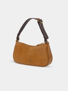 The Charmed Baguette Bag is constructed with a gentle curve and slim structured silhouette for a vintage-inspired look. The signature belt loop detail allows for the strap to be lengthened-- perfect to carry on hand, or use the shoulder strap for a hands-free style. - USA full-grain textured calfskin leather - Matching color leather interior - One internal slip pocket - Removable and adjustable shoulder strap - Product Care - Width: 11” - Height: 6" - Depth: 2" - Strap drop: 8.5" - Weight: 0.8lb Classic Handheld Baguette Bag For Everyday, Evening Brown Baguette Bag With Adjustable Strap, Brown Baguette Bag With Detachable Strap, Classic Baguette Bag With Adjustable Strap, Classic Baguette Shoulder Bag With Adjustable Strap, Classic Handheld Baguette Bag With Adjustable Strap, Classic Clutch Baguette Bag With Adjustable Strap, Formal Handheld Baguette Bag With Adjustable Strap, Brown Baguette Bag For Evening