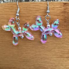 Light Weight Balloon Dog Earrings. Light Weight Plastic. Iridescent Clear With Pink, Purple, Green Tones. 1.5 Inches. Silver Ear Wires And Beads. Balloon Dog Earrings, Spongebob Earrings, Dog Earrings, Balloon Dog, Green Tones, Purple Green, Sloth, Ear Wires, Pink Purple