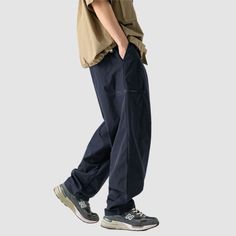 Material: 100% PolyesterFeatures: Pants, cargo pants, wide legs, slightly stretchy, drawstring waist, solid color, straight-leg, relaxed fit, unisex, couple outfits.Style: Casual, college, streetwear Wide-leg Work Pants With Cargo Pockets For Streetwear, Casual Wide-leg Cotton Cargo Jeans, Baggy Cargo Pants With Cargo Pockets, Baggy Casual Cargo Pants With Pockets, Casual Wide Leg Cargo Pants For Streetwear, Solid Wide Leg Pants With Pockets For Streetwear, Solid Straight Leg Cargo Pants For Streetwear, Utility Wide Leg Pants With Pockets For Streetwear, Casual Straight Parachute Pants With Cargo Pockets