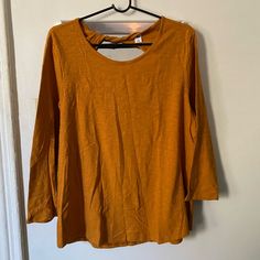 Turmeric Colored Long Sleeve Top Cutout On The Back, With Twist Fabric Never Worn Casual Mustard Long Sleeve Top, Mustard Long Sleeve Blouse For Fall, Mustard Long Sleeve Casual Shirt, Fall Yellow Crew Neck Blouse, Casual Mustard Cotton Blouse, Mustard Relaxed Fit Top For Spring, Yellow Crew Neck Shirt For Fall, Fall Yellow Crew Neck Shirt, Mustard Long Sleeve Cotton Shirt