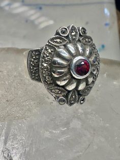 Art Deco ring marcasite band garnet Solid band Size 4.50 sterling silver women girls Size 4.50 Weight. 8.5g  Length  3/4" Width 5/8"" Band in Back  3/16" Free Shipping & Free Postal Insurance  Delivered in a Gift Box  Free First Class shipping and postal insurance is included. If you want to upgrade to priority kindly pay an additional fee to do so.  This is recommended if you would like to have your package delivered faster than first class which has slowed down Silver Garnet Ring Stamped 925, Victorian Silver Ring With Garnet, Marcasite Sterling Silver Rings For Gifts, Victorian Style Garnet Silver Ring, Antique Silver Garnet Rings, Silver Spiritual Garnet Rings, Victorian Garnet Silver Ring, Marcasite Earrings Art Deco, Art Deco Marcasite Jewelry Gift