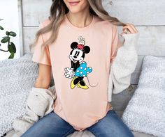 Minnie Mouse Shirt - Cute Minnie Mouse T-Shirt - Beauty Minnie Shirt - Gift For Wife - Mickey Mouse Shirt - Mickey Couple T-Shirt How can I order? 1️) Please review all the information provided before placing an order 2️) Select the shirt type and size. 3️) Select the color of the shirt using the following options. 4️) Need more Items? Add the current item in the cart. And If you like to add more items to your order please press the back button and repeat steps 1-4 again. 5️) Once all your desired items are in your cart you may complete your order by entering your payment method, desired shipping address and click submit. When will my product arrive? Processing Time: 1-3 days During holidays please expect delays as the amount of orders are slightly higher than usual, although we will do ou Cute Minnie Mouse Shirt With Crew Neck, Pink Crew Neck Top With Mickey Mouse, Casual Crew Neck Minnie Mouse Shirt, Cute Minnie Mouse Crew Neck Shirt, Pink Mickey Mouse Crew Neck Top, Casual Minnie Mouse Crew Neck Shirt, Pink Mickey Mouse T-shirt With Crew Neck, Pink Mickey Mouse Crew Neck T-shirt, Mickey Mouse Gifts