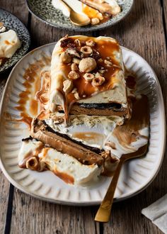 a piece of cake sitting on top of a white plate with caramel toppings