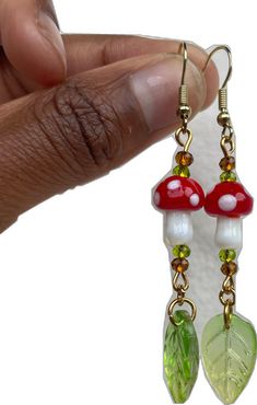 Funky Handmade Dangle Jewelry, Fun Mushroom Design Jewelry For Gifts, Fun Mushroom Design Jewelry Gift, Funky Adjustable Dangle Earrings, Adjustable Green Mushroom Design Earrings, Green Adjustable Mushroom Design Earrings, Adjustable Green Earrings With Mushroom Design, Whimsical Adjustable Beaded Dangle Earrings, Funky Red Handmade Jewelry