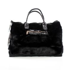 This spacious carrying bag features a fur and leather exterior and designer stylings that make it an impact making addition to any outfit and perfect for either casual or business outings. Product Dimensions (Inches): 21 x 13 x 11 Faux-Leather and Fur Exterior Polyester Lining Luxury Winter Shoulder Bag For Shopping, Black Faux Fur Shoulder Bag For Winter, Winter Black Faux Fur Shoulder Bag, Luxury Faux Fur Shoulder Bag With Fur Lining, Black Faux Fur Bags For Winter, Luxury Tote Bag For Winter, Luxury Faux Fur Shoulder Bag, Luxury Travel Bags For Winter, Luxury Black Shoulder Bag For Winter