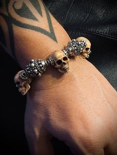 Bracelet Profile: 🔱 Our skull bead bracelet is made of meticulously carved deer antler skulls and high contrasting 925 silver beads, completed with elaborately detailed Mortis Ores signature T-bar clasp. The silver Babylon beads have a diameter of 20 mm making this skull bracelet a real complementary piece for our statement rings. 🔱 The antique finished sterling silver beads with intricate ornaments add contrast and character to the bracelet while the little skulls beads impress with their fin Exotic Jewelry, Silver Bead Bracelet, Skull Bracelet, Deer Antler, Beaded Skull, Bespoke Jewellery, Engraved Jewelry, Engraved Items, Sterling Silver Bead