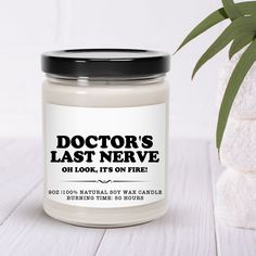 a jar of doctor's last nerve on a table next to a potted plant