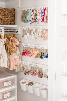 the closet is organized with clothes and other items