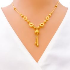 This 22k gold necklace, with a weight of 9.1 grams, showcases a charming cutwork flower design, beautifully rendered in a gleaming yellow gold finish. The necklace spans 17 inches in length, featuring a drop of 1.25 inches, and comes with 1 inch of adjustable links for a tailored fit, secured by an S lock. The intricate cutwork adds a touch of delicacy and elegance, making this piece perfect for those who appreciate the beauty of floral motifs combined with the luxurious appeal of gold. Ideal for adding a sophisticated and feminine touch to any outfit, this necklace is a testament to exquisite craftsmanship and timeless style. PRODUCT DETAILS Gold Purity(karat): 22k Gold Weight(grams): 9.1 Item Finish: Yellow Gold Necklace Length: 17" Drop Length: 1.25" Adjustable Links: 1" Links Lock Styl Traditional Yellow Gold Flower Pendant Necklace, 22k Yellow Gold Flower Pendant Necklace, Gold Flower Pendant Necklace In 22k, Gold Necklace With 22k Gold Flower Pendant, 22k Gold Flower Pendant Necklace, 22k Gold Necklace, Yellow Gold Necklace, Floral Motifs, Cut Work