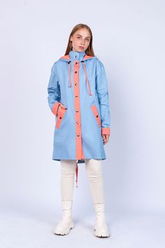 "Women's Blue-Coral Fashion Unique Raincoat ''ANTIGUA\" 546/136 Handmade in Lithuania.  Enjoy functional and stylish raincoat. This raincoat is waterproof and wind-resistant to keep you warm and dry.  Raincoat is with a hood and has front pockets with buttons. Color: Blue-Coral  Material: 100% Polyester, coated with PU Lining: 100% Rayon, coral color Size: XS, S, M, L, XL, XXL Precise raincoat size (cm/inch) You can find in photos area." Hooded Weatherproof Raincoat For Spring, Spring Weatherproof Hooded Raincoat, Weatherproof Hooded Raincoat For Spring, Fall Blue Parka With Detachable Hood, Raincoat With Detachable Hood For Rainy Season, Blue Hooded Winter Raincoat, Casual Long Waterproof Raincoat, Winter Blue Raincoat With Pockets, Winter Blue Outdoor Raincoat