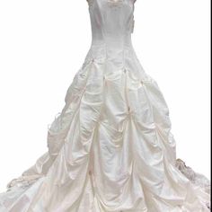 a white wedding dress is displayed on a mannequin