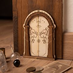 a wooden clock sitting on top of a table