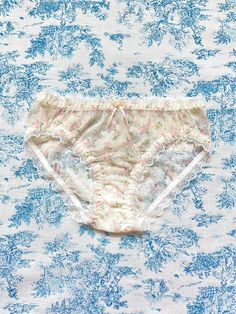 The Floral Lace Trim Panty features an elegant ivory mesh with a delicate floral print, complimented by a white lace trim and charming bow and rose details. Made with a soft 100% cotton lining, this panty offers both comfort and style for any occasion. Size Chart: XS: Waist 23-25 inches, Bust 29-31 inches S: Waist 26-28 inches, Bust 32-34 inches M: Waist 29-32 inches, Bust 35-38 inches L: Waist 33-36 inches, Bust 39-42 inches XL: Waist 36-39 inches, Bust 43-47 inches 2XL: Waist 39-41 inches, Bus Feminine Lace Trim Brief Bottoms, Spring Lace Brief Bottoms, Spring Lace Bottoms With Floral Print, Feminine Delicate Lace Bottoms For Summer, Feminine Floral Print Bottoms For Daywear, Feminine Summer Bottoms With Delicate Lace, Spring Floral Print Lace Bottoms, Beige Lace Bottoms For Daywear, Feminine Beige Bottoms With Delicate Lace