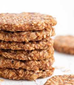 a stack of oatmeal cookies sitting next to each other on top of a table