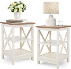 two white side tables with flowers on top and a vase next to eachother