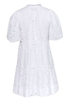 Twirl into summer with Tuckernuck's charming babydoll dress! Featuring dainty eyelet lace and romantic ruffled trim, this playful dress is perfect for any occasion. The stylish split neckline and short puff sleeves add a touch of flair to this breezy cotton number. Pair with brown slide sandals and a raffia bag for a lovely summer look. Size S 100% Cotton Lined Pullover Split neck Babydoll Short puff sleeves Ruffled trim Bust 36" Waist 34.5" Shoulder to hem 34" Sleeve length 12.5" Summer Tiered Dress With Scalloped Lace, Casual Tiered Broderie Anglaise Dresses, Spring Lace Mini Dress With Eyelet, Spring Lace Mini Dress With Eyelet Details, Spring Eyelet Lace Mini Dress, Summer Cotton Dresses With Scalloped Lace, Summer Cotton Dress With Scalloped Lace, White Eyelet Mini Dress For Summer, Lace Eyelet Dress For Day Out