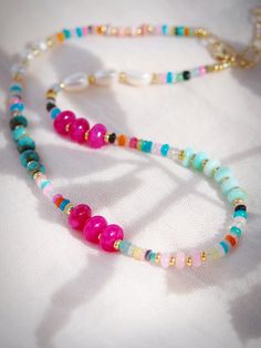 This modern mixed rainbow gemstone and pearl necklace is a must have. The elegant mix of pearls and gemstones including opals, turquoise, quartz and more make this beaded bracelet versatile and an instantaneous favorite.✦ Other necklaces sold separately - Kyani is wearing the 15"+ Length ✦✦ DETAILS ✦✧ Name: Kainui (kaee NOO ee) - big sea, great sea.✧ Mixed Gemstones and Freshwater Pearls.✧ Adjustable fit - choose your length.✧ 14kt Gold Filled components and clasp.✧ All Ke Aloha Jewelry pieces c Multicolor Pearl Jewelry With Gemstones, Rainbow Pearl Jewelry With Colorful Beads, Rainbow Colored Pearl Jewelry With Colorful Beads, Big Sea, Ethiopian Opal Necklace, Hawaii Jewelry, Blue Opal Necklace, Fire Opal Necklace, Rainbow Opal