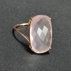 This stunning ring is set in 14k Solid Yellow Gold with Natural Rose Quartz with utmost precision. It is a unique statement gemstone ring for nearly every occasion and is completely hassle-free jewelry. ITEM DETAILS: *  GEM: Rose Quartz * GEM SIZE: 20X12mm * GEM SHAPE: Rectangle Cushion * Total Gem weight: 9.65 carats * Gold Purity: 14KT  * Gold Weight: 1.54 gram * Total Weight of the Ring: 3.47 gram The Gold purity is guaranteed and it comes with an authentic 14KT gold hallmark. Since my items Luxury Rectangular Pink Rings, Luxury Pink Rectangular Rings, Elegant Rectangular Gemstones For Formal Occasions, Elegant Rectangular Gemstones For Formal Events, Elegant Rose Gold Jewelry With Rectangular Stone, Formal Pink Rectangular Ring, Elegant Rectangular Gemstones For Anniversary, Formal Pink Rings With Rectangular Stone, Elegant Ring With Faceted Rectangular Stone