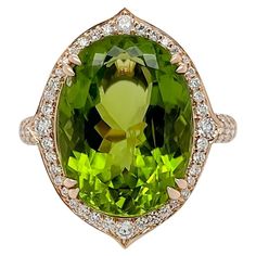 A natural and eye clean 10.03ct Peridot is the star of this ring. The striking green is designed with a halo of diamonds featuring pointed edges. The under mounting of this ring was also designed intricately in a floral motif completed by a rounded paved band. Its all about the details and set in 18K rose gold. Our diamonds are natural and we use top quality G VS only. This ring is in a size 7 and can be resized. This piece of jewelry comes certified and also comes with an original certificate o Thai Modern, Gold For Sale, Fine Jewellery, Cocktail Rings, 18k Rose Gold, The Star, Floral Motif, Or Rose, Halo