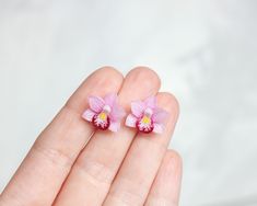 Miniature stud earrings with light pink orchid flowers. Suitable for every day. Flowers are made by hand from polymer clay, not fragile, not afraid of water. *   *   *    *    *    *    *    *    *    *    *    *    *    *   The earrings in the photos have been SOLD.  You will receive a repeat of these earrings.  As this is a handmade item, each new item may vary slightly, but the overall look will be the same as that shown in the photo. Please pay attention to the timing of jewelry making *   * Handmade Pink Flower Earrings In Polymer Clay, Pink Flower-shaped Polymer Clay Earrings, Pink Handmade Flower Polymer Clay Earrings, Pink Flower Shaped Polymer Clay Earrings, Pink Polymer Clay Flower Earrings, Pink Polymer Clay Flower Earrings For Gift, Pink 3d Flower Polymer Clay Earrings, Pink Polymer Clay Earrings With 3d Flowers, Small Pink Flowers