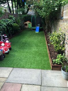 an image of a backyard with grass and toys in the back yard, as seen on instagram