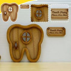 tooth shaped wooden signs and magnets on a wall