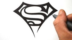 the superman symbol is drawn in black ink on a white background, and it appears to be