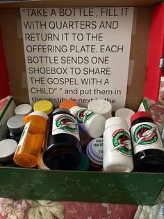 a box filled with different types of condiments next to a sign that reads, take a bottle fill it with quarters and return it to the