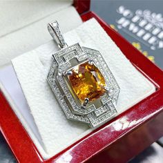 HUGE! Custom designed, DOUBLE HALO, Art Deco STYLE, YELLOW SAPPHIRE & Sparkling diamonds in handcrafted 18K solid white gold pendant! So sparkling in person! We are confident that you will love it! Vivid yellow color, perfect sparkling and lustrous natural yellow sapphire, at 7.45 carats, that's just beyond rare! SURROUNDED BY 0.90 CARATS OF F/VS NATURAL, DIAMONDS, SET IN 18K SOLID WHITE GOLD! What you see is what you will get! One of a kind SUGGESTED RETAIL VALUE: $8,800 SAPPHIRE: Weight: 7 White Gold Citrine Jewelry With Halo Setting, Fine Jewelry White Gold Citrine, White Gold Diamond Cut Citrine Jewelry, Gia Certified White Gold Pendant Jewelry, Gia Certified White Gold Pendant, Yellow Platinum Fine Jewelry, Citrine Jewelry With Halo Setting For Gift, Gia Certified Yellow Gold Pendant Jewelry, Gia Certified Platinum Jewelry In Gold Color