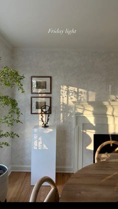 a dining room with a table and chairs next to a fire place