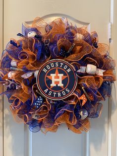 a houston astros mesh wreath on the front door