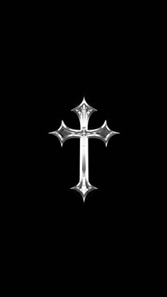 a silver cross on a black background