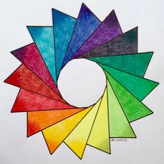 colored pencils arranged in the shape of a spiral